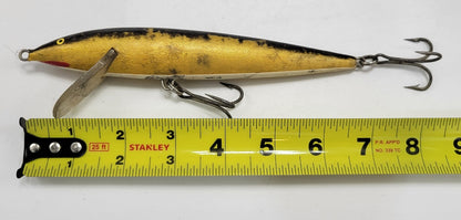 RAPALA MAGNUM FLOATING #18 BLACK, GOLD, WHITE AND RED WITH YELLOW AND BLACK EYES IS GREAT FOR THOSE BIG FISH