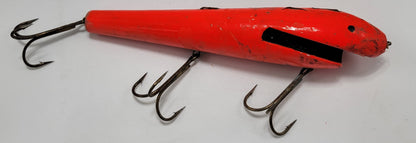 LARGE ORANGE WOODEN 10" LURE with BLACK EYES AND MOUTH AND 3 HOOKS.