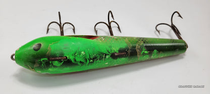 LARGE 8" GREEN, RED, GOLD AND OFF WHITE FISHING LURE WITH BLACK AND WHITE EYES AND RED MOUTH