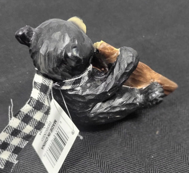 Black and white decorative Bear with a visible brand label.