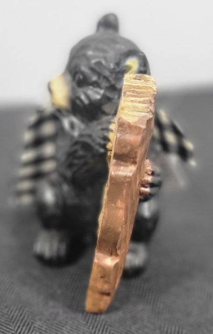 Black bear side with sign