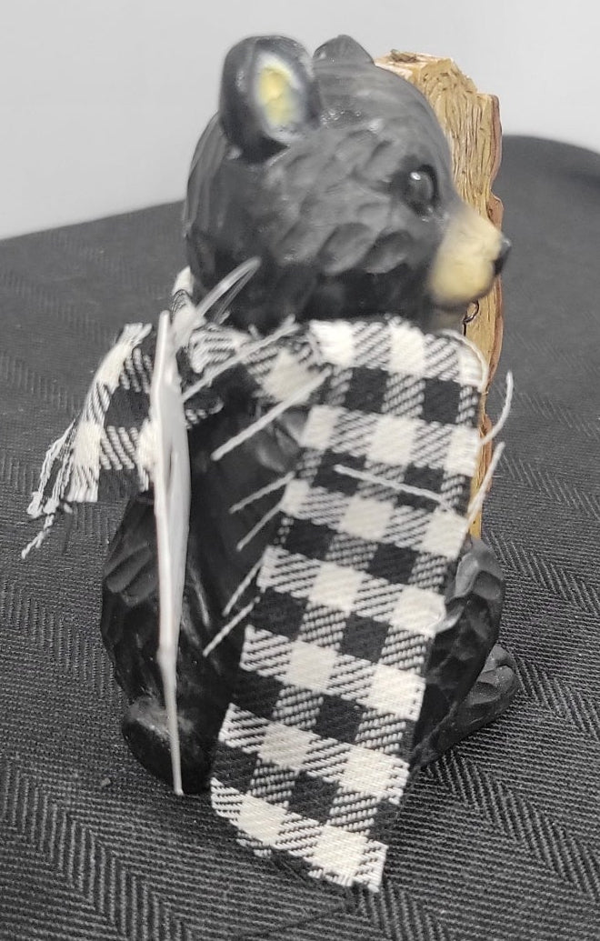 Black and white checkered fabric on black bear